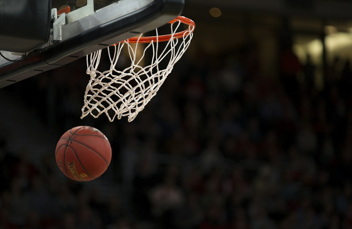 Basketball dropping through the net